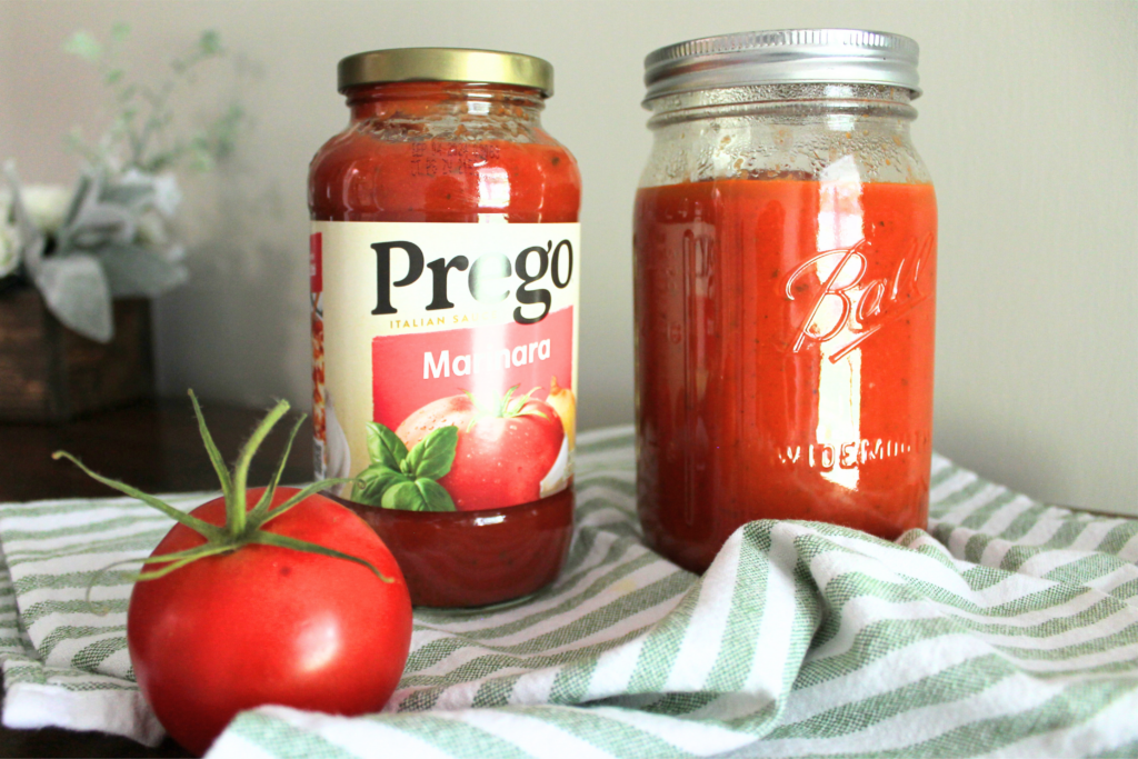 Prego jar and homemade sauce jar, tomato on stripped tea towel