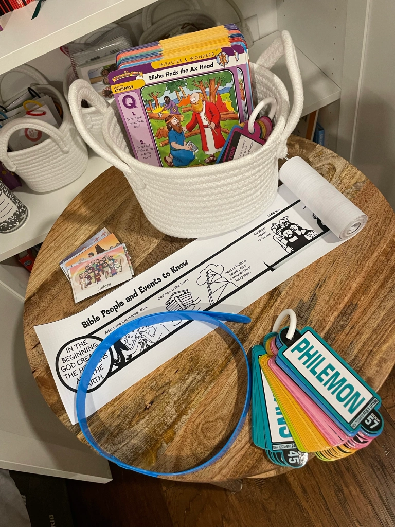 basket full of cards, timeline, and books of the bible ring