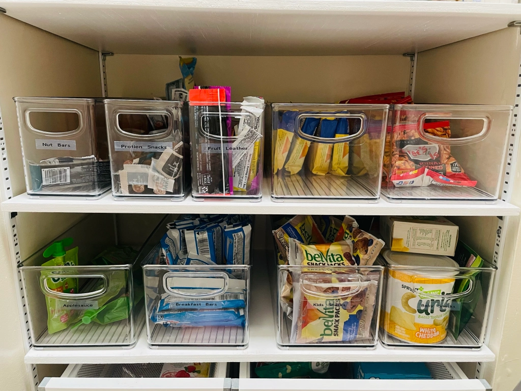 acrylic bins filled with pantry staples 
