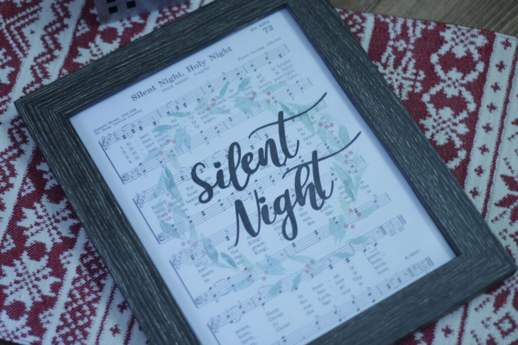 front wooden frame displaying the silent night Christmas decor art 
