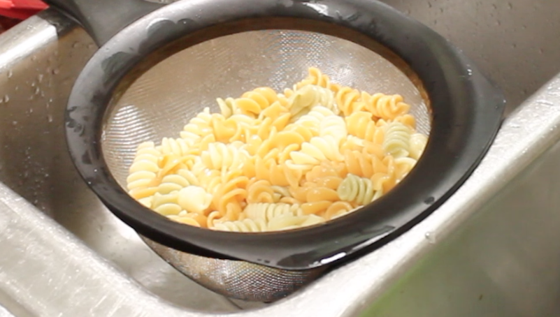 pasta in strainer over sink