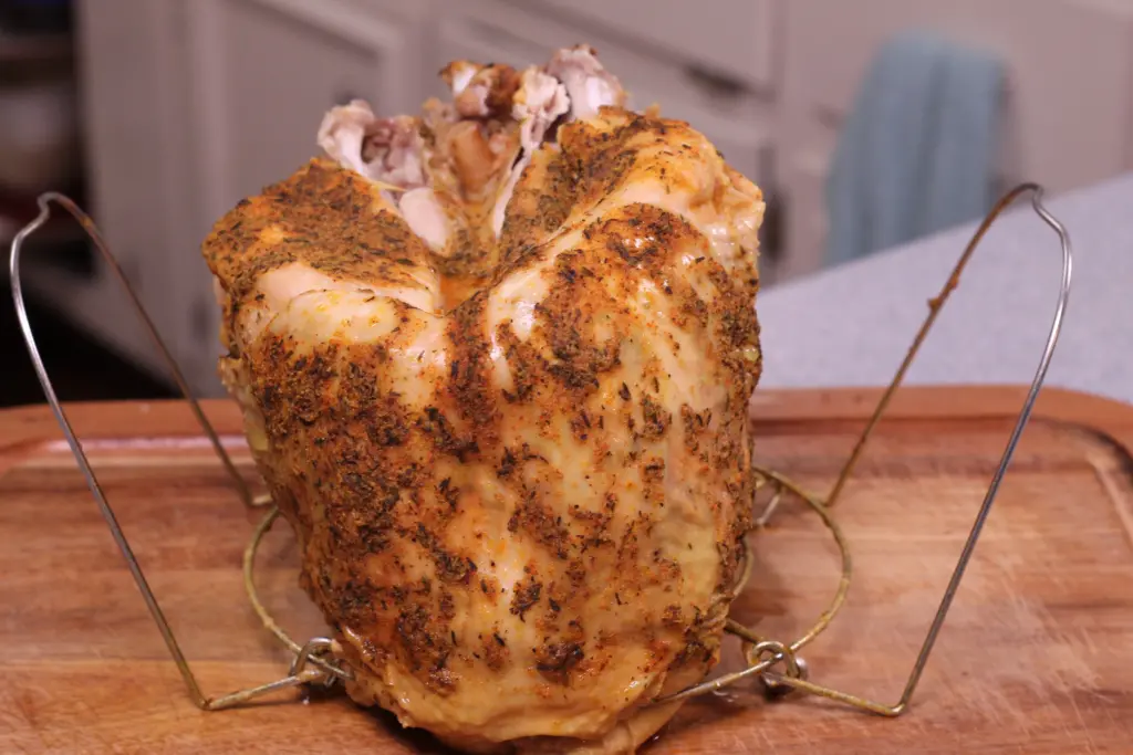 cooked turkey breast cooling on the instant pot rack