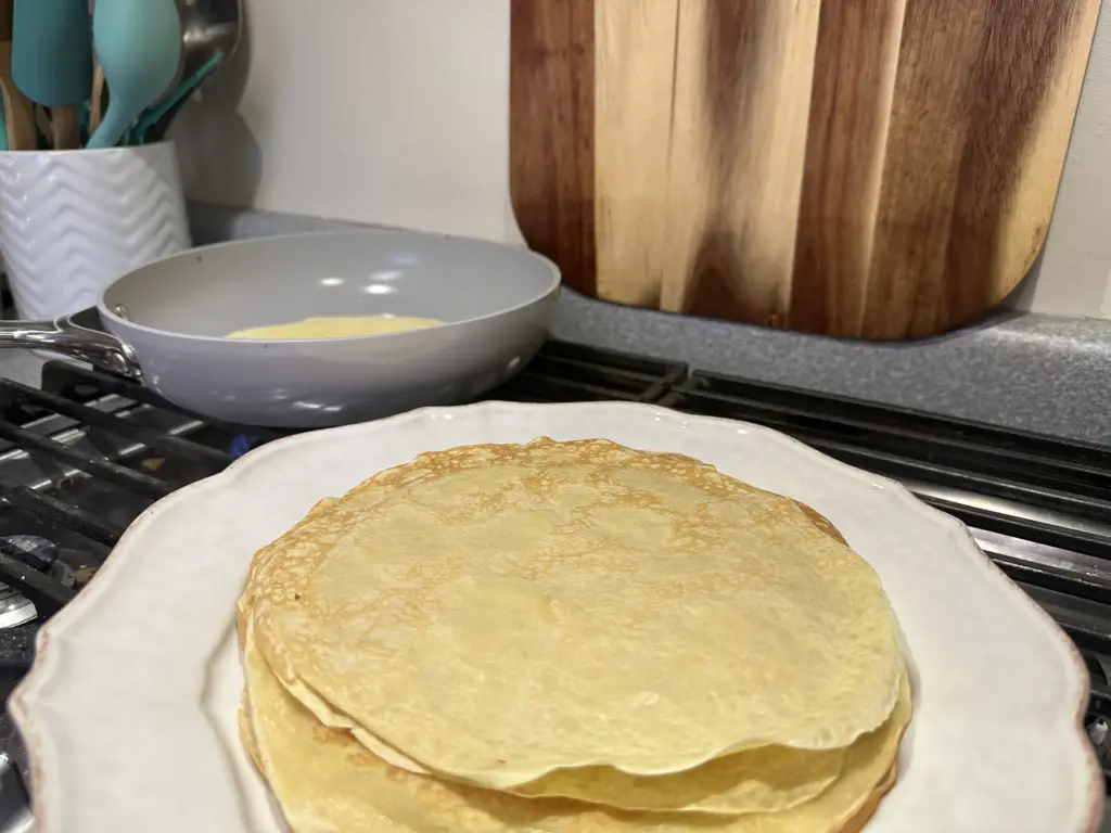 stack of crepes while cooking more