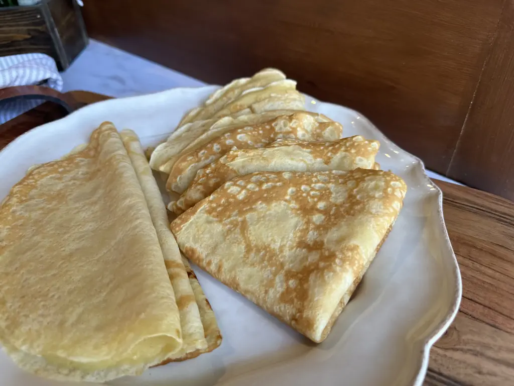 folded crepes on a plate