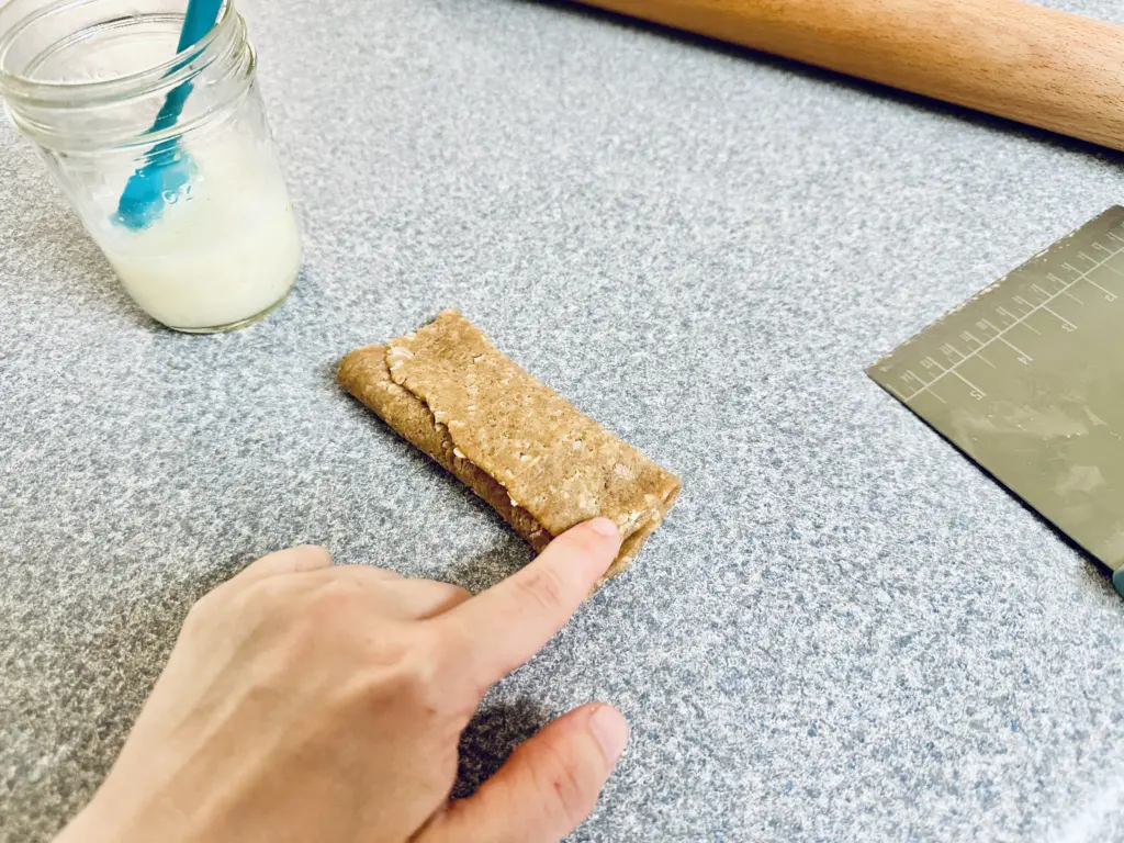 pressing edges together of sourdough Nutri-Grain bar