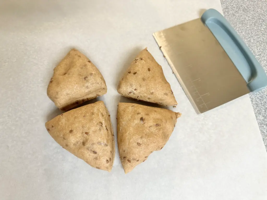 sourdough discard cracker dough divided into 4 parts