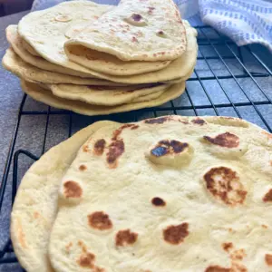 potato flake sourdough tortillas on cooling rack