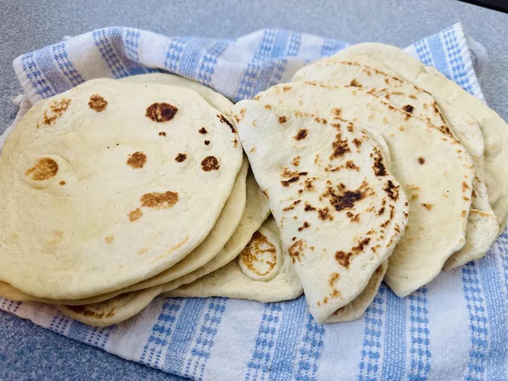 potato flake sourdough tortillas on a tea towel