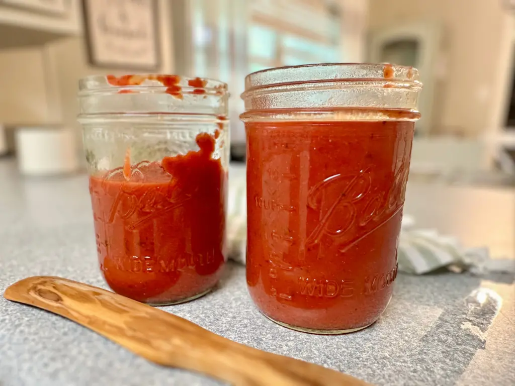 homemade pizza sauce made using tomato paste put into jars