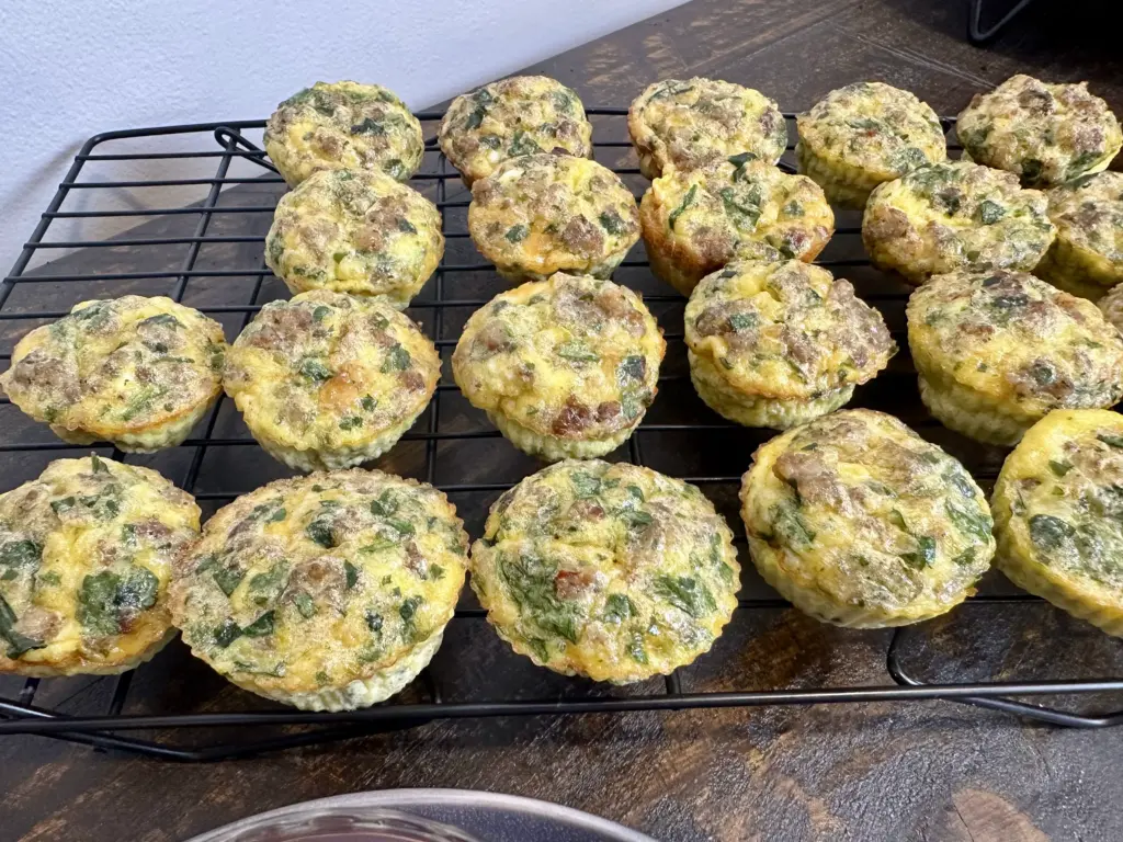 spinach and sausage egg muffins on cooling rack