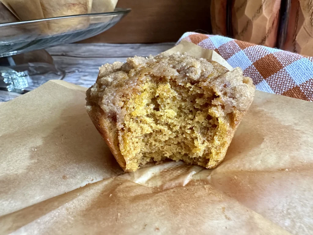potato flake sourdough pumpkin muffin with bite taken out