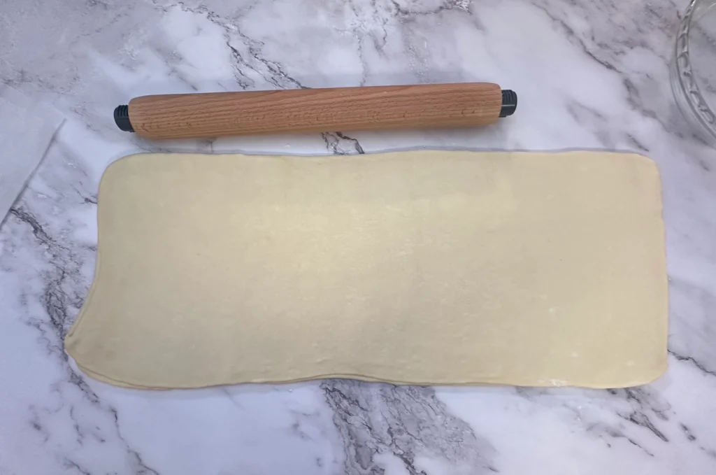 letter fold first step in laminating potato flake sourdough croissant
