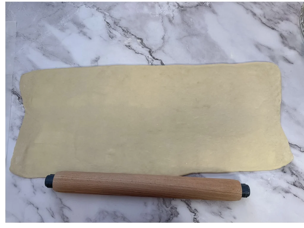 rolling out croissant dough to 24x10"