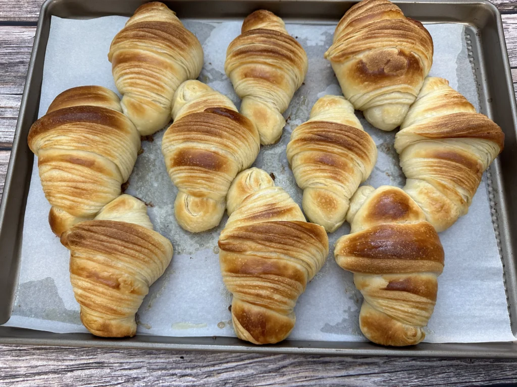 flakey sourdough croissants make with potato flake starter on baking sheet