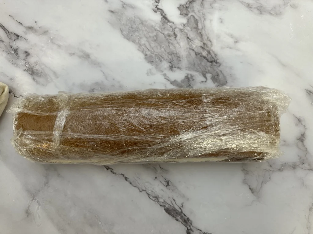 pumpkin roll wrapped in plastic wrap 