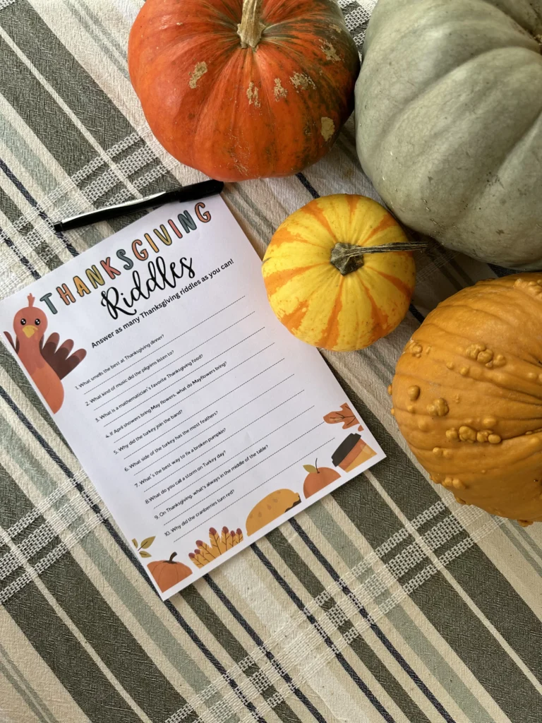 thanksgiving riddles on a paper with turkey and fall decor 