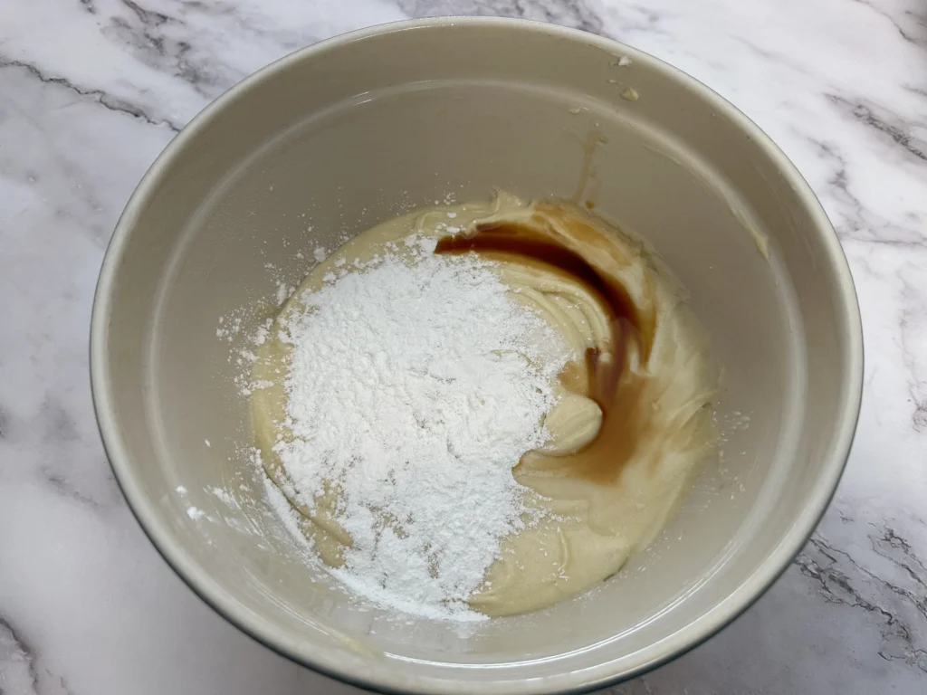 add baking powder and vanilla to potato flake sourdough coconut cake batter