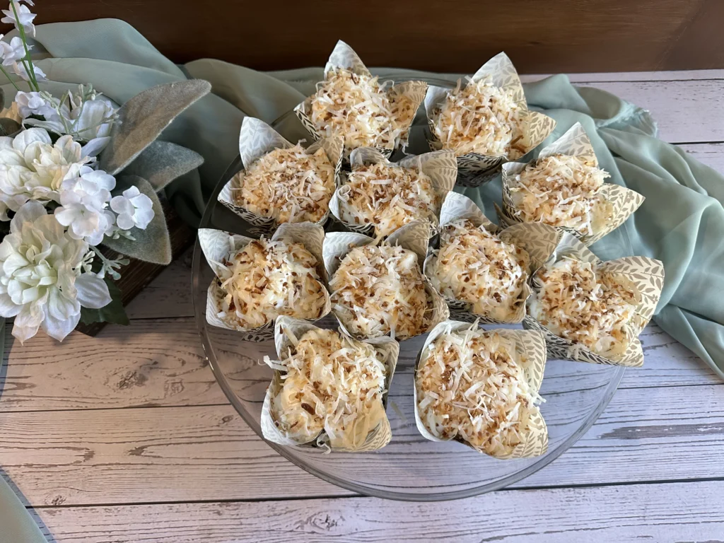 potato flake sourdough coconut poke cupcakes on cake stand