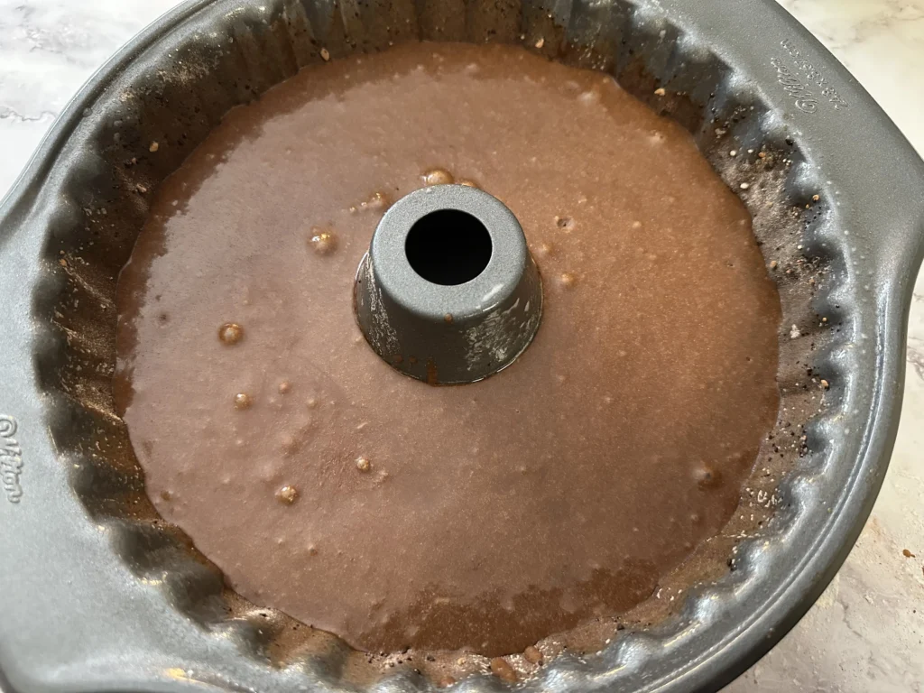 potato flake sourdough chocolate cake batter in bundt cake pan 