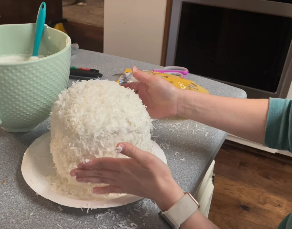 assembling potato flake sourdough coconut poke cake