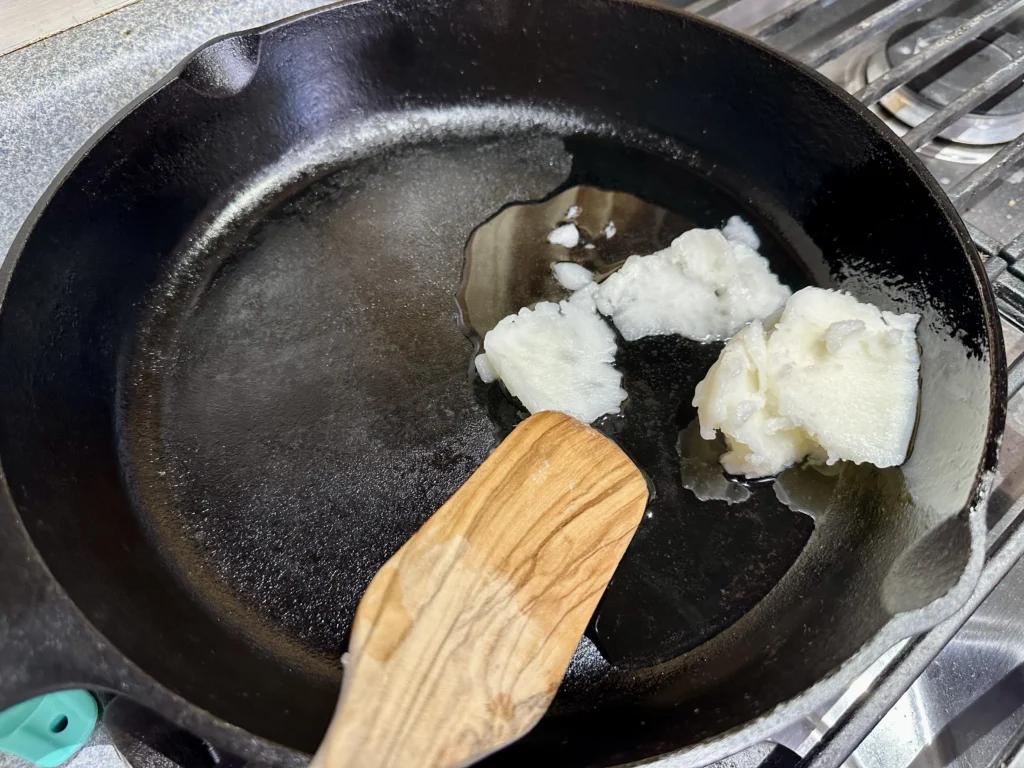 coconut oil in the cast iron skillet for frying salmon fish sticks