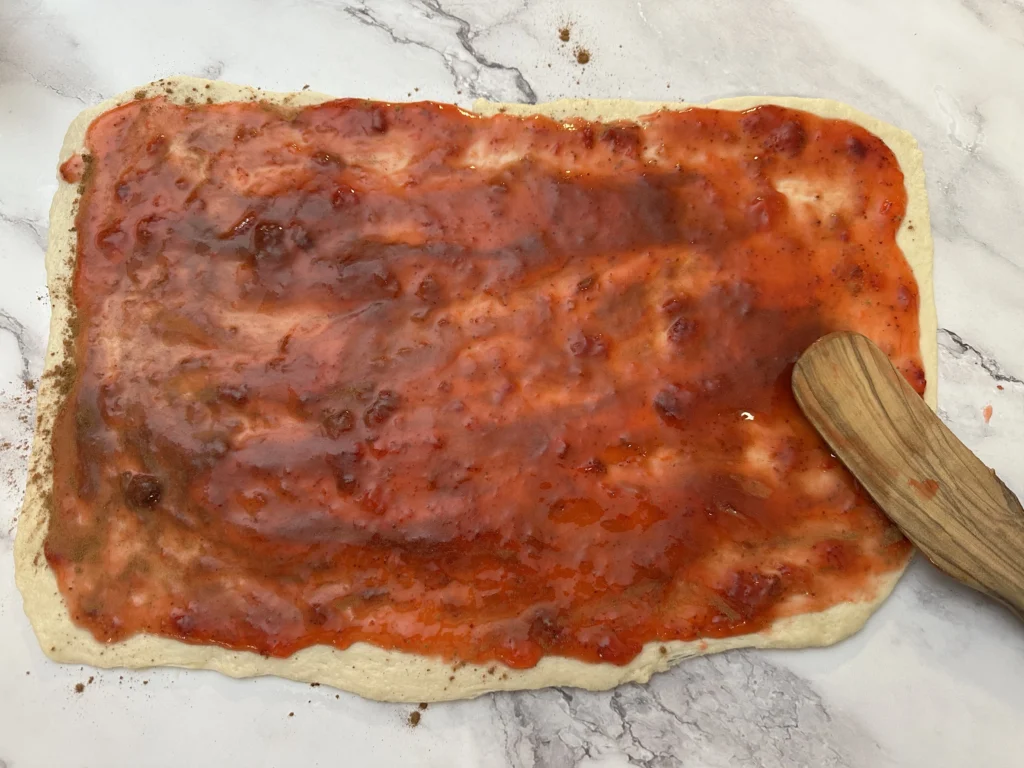 strawberry jam on dough