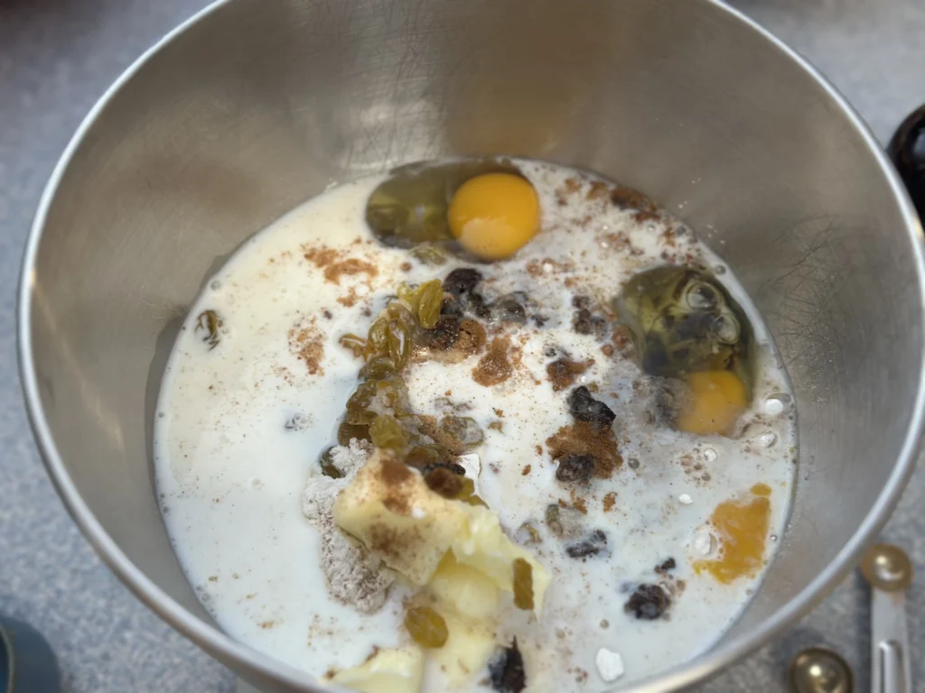 potato flake sourdough hot cross buns ingredients in a stand mixer bowl 