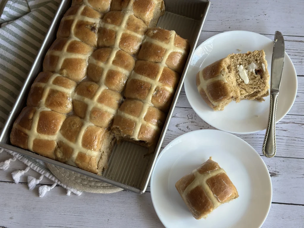potato flake sourdough hot cross buns prepared on a plate with butter 