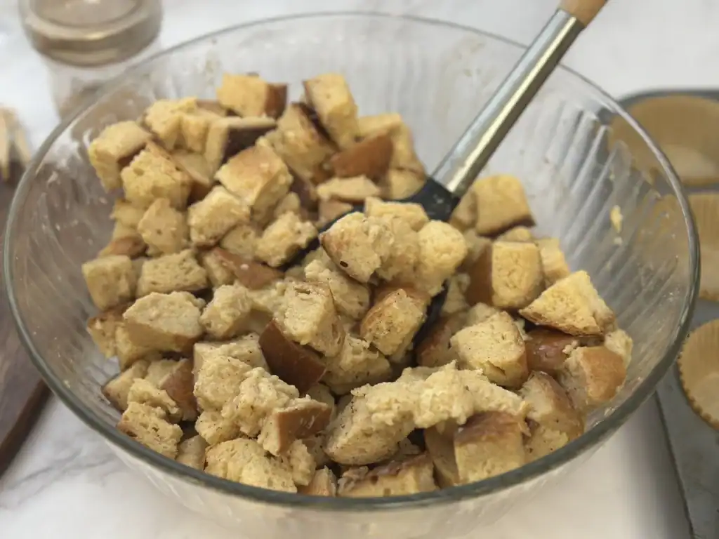 tossing bread cups in custard